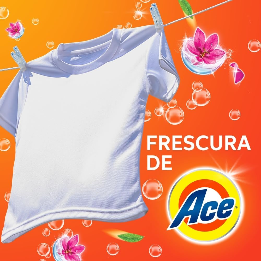 A white short-sleeve t-shirt hanging on a clothesline with plastic clips against a bright orange background, with floating bubbles, pink flowers, and the Ace detergent logo and the Spanish text 'FRESCURA DE ACE
