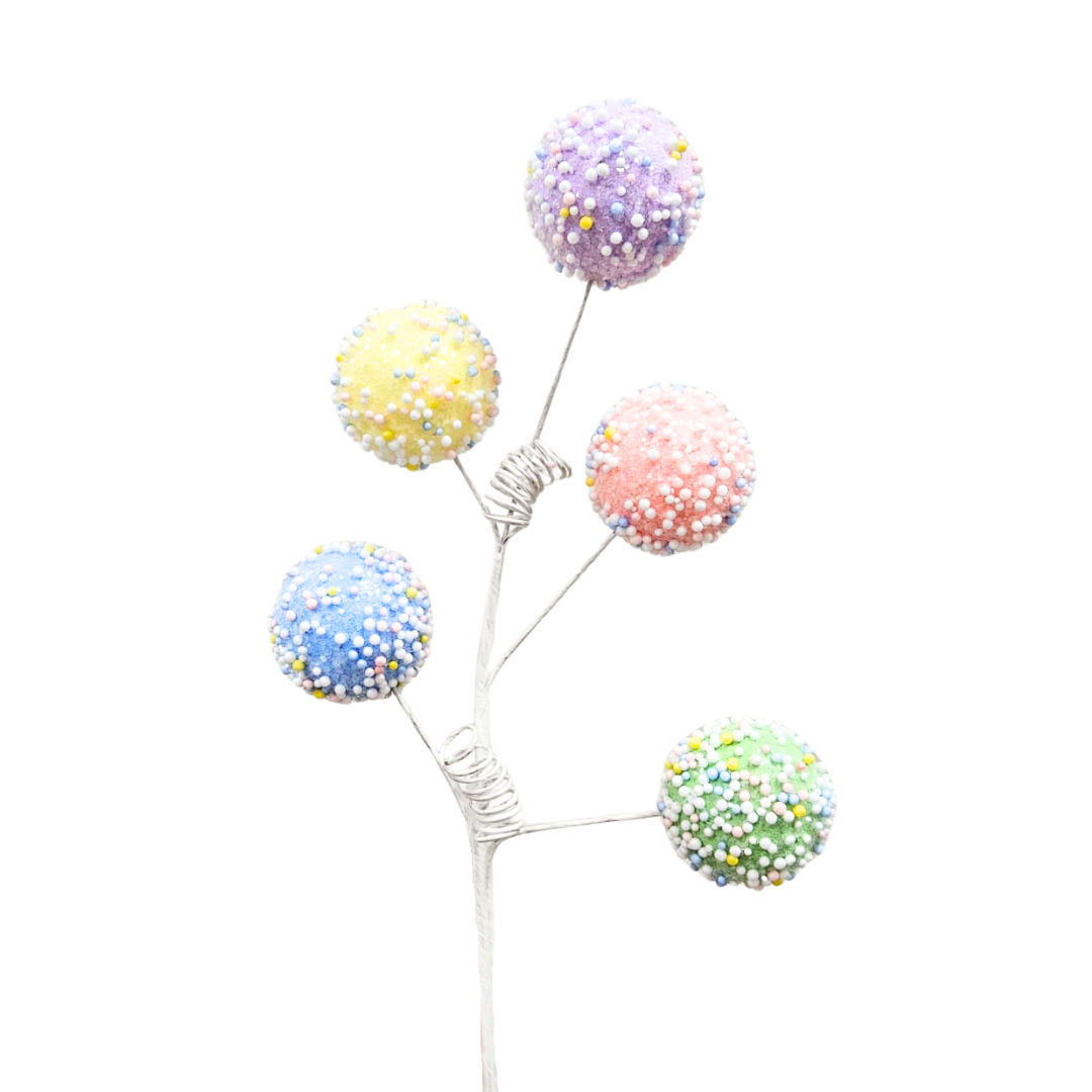 Spray decorativo pastel con esferas tipo caramelo