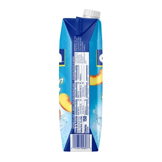 A blue carton of juice with a white cap, shown from the side on a plain white background. The carton features peach slices and partial branding.